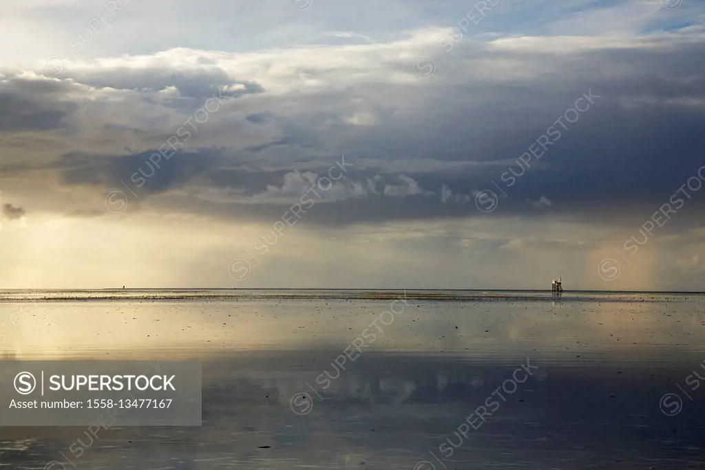 reflection of the evening sky on the sandbank of Westerhever in front of the peninsula Eiderstedt,
