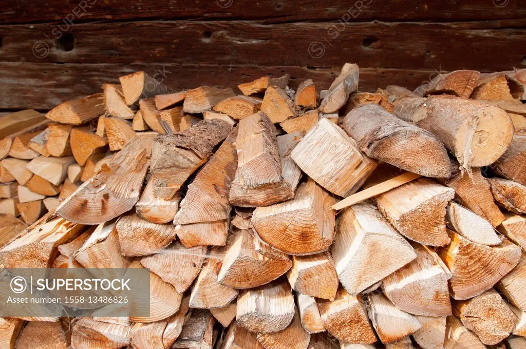 wooden logs in front of wooden wall