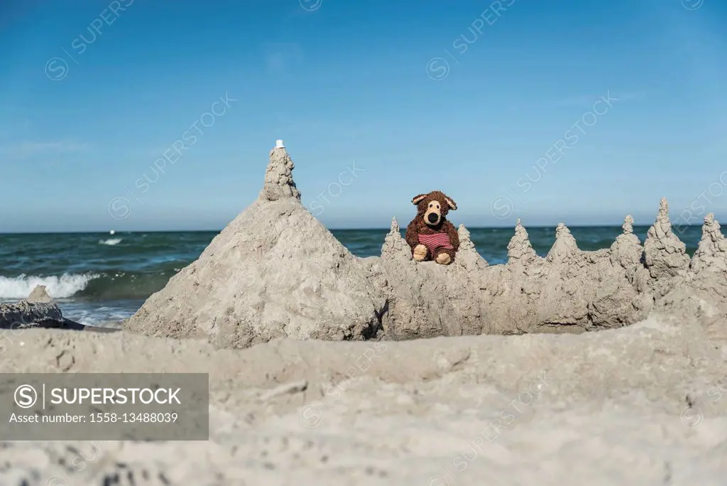 Teddy in beach castle, in the background the Baltic Sea,
