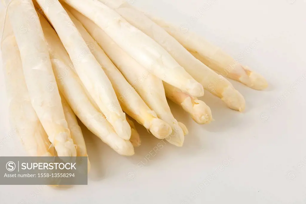 White asparagus spears on white table
