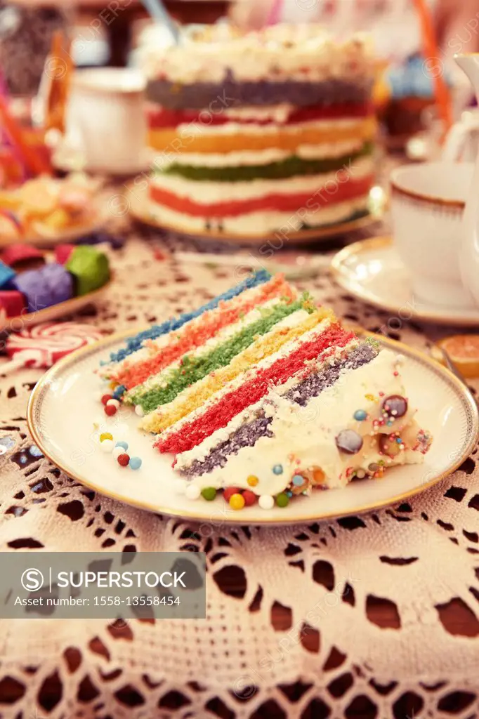 Rainbow Layer Cake on a Kids Party Table with decoration
