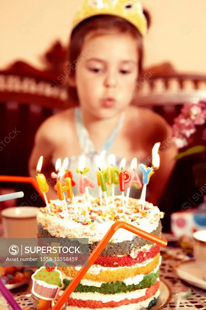 Party Girl blows out candle on her birthday cake