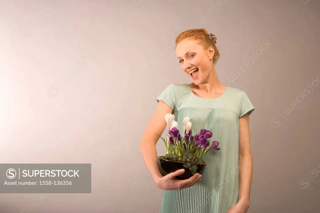 Woman, flower-peel, crocuses, holding, cheerfully, laughs, watching, camera, studio, semi-portrait, 20-30 years, stands, series, red-hairy, beauty con...