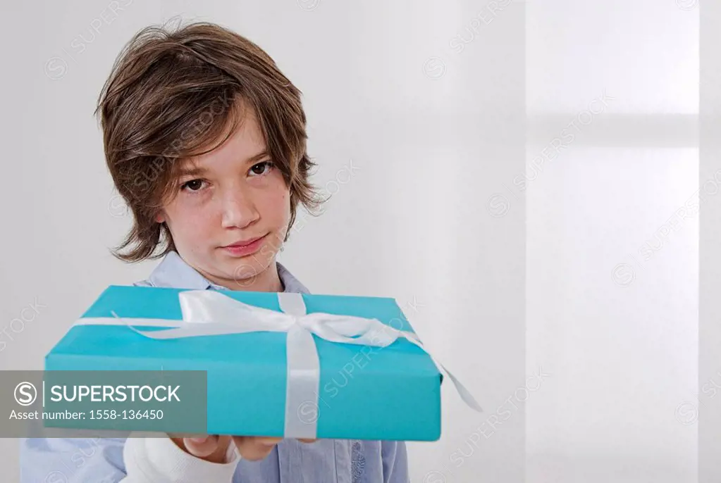 Teenager, boy, seriously, gift, giving, portrait, people, teenagers, holding, giving, giving, offers, surprise, packet, thanks, gift-packet, birthday-...