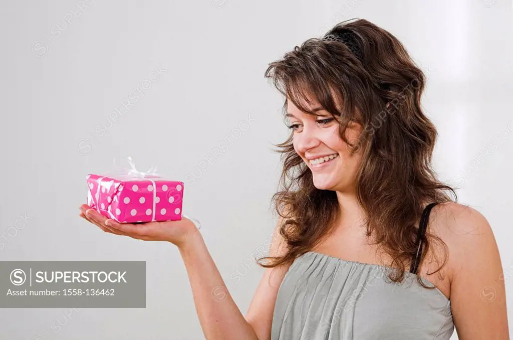 Teenager, girl, cheerfully, gift, smile views, semi-portrait, people, teenager-girl, teenagers, happily, shows, giving, presents, gets, holding, surpr...