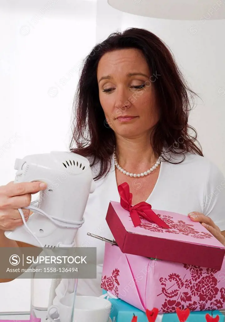 Woman, gift, facial expression, unpacks disappointed, views, blender, portrait, table, people, housewife, sorrowfully, unhappy, sullen, unsatisfied, w...