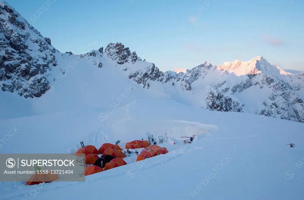 Alpine panorama at sunrise, camp, base camp