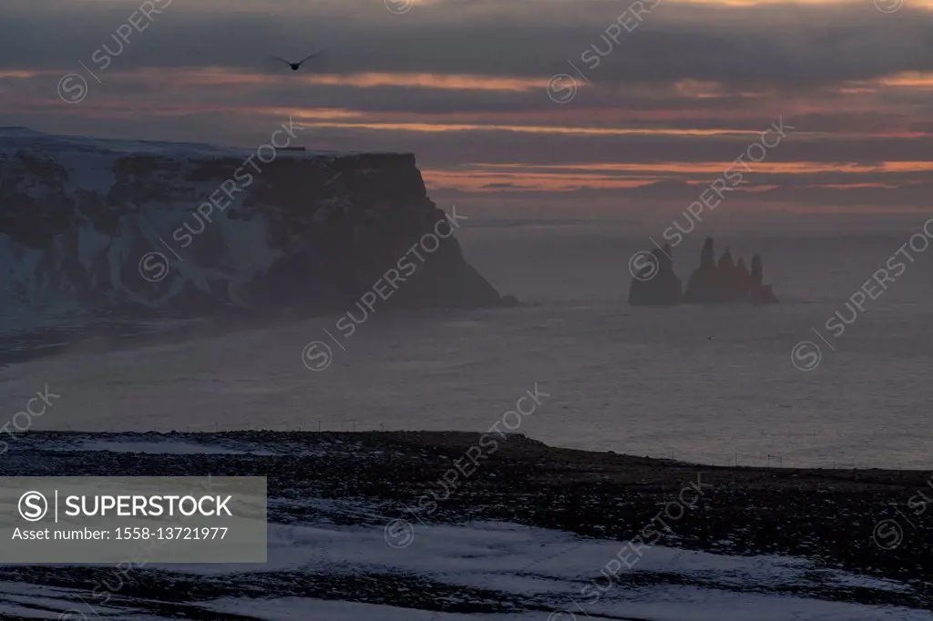 Morning mood at Dyrholaey on Iceland with Reynisdrangar rocks in the background