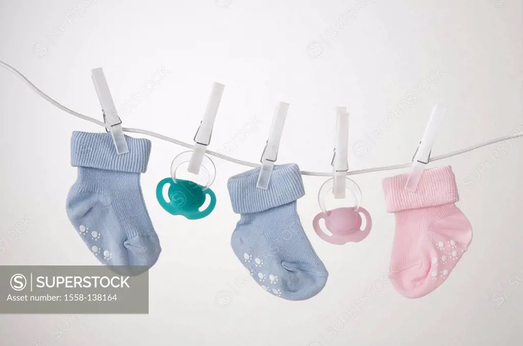 Clothes line, baby-socks, pink, light-blue, pacifiers, clothes pins,