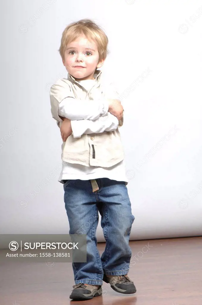 boy, blond, stands, poor, series, crosses people, child toddler 2-3 years, watching, camera, shirt beige, jeans, expression, studio, indoors, full-len...