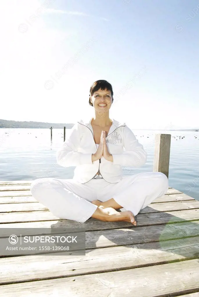 Sits woman, bridge, meditation-practice, smiling, series, people, full-length, 30-40 years, brunette, knows barefoot, clothing, tailor-seat, leisurewe...