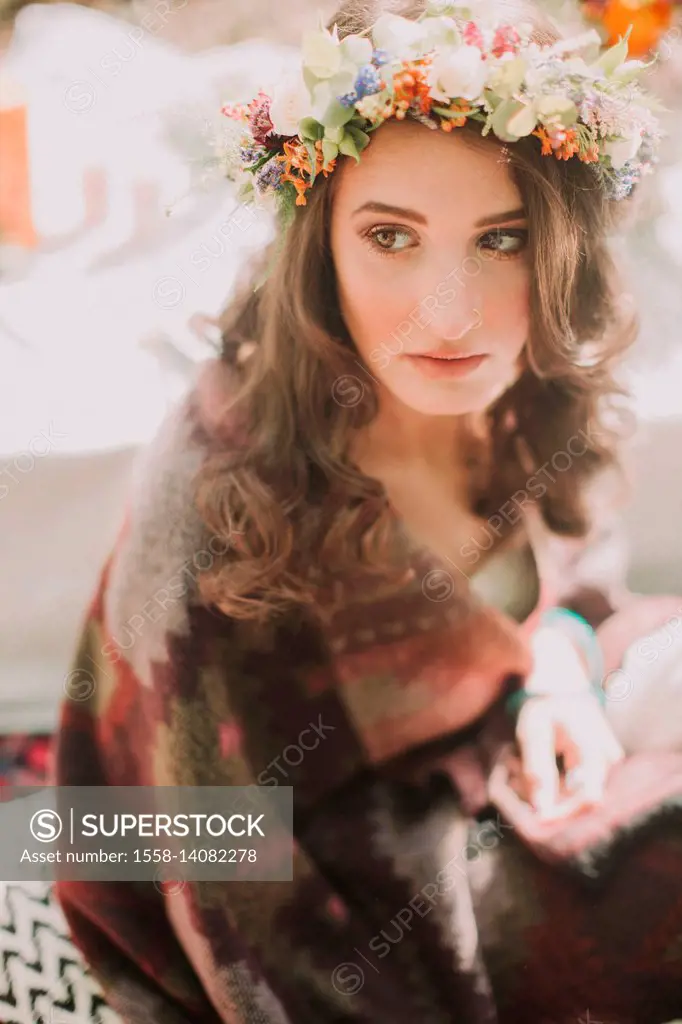 Alternative wedding, bride with wreath of blossoms, serious, uncertainly, thoughtfully, portrait