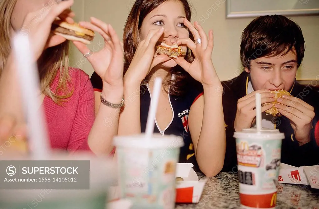 Group of young persons in fast food restaurant
