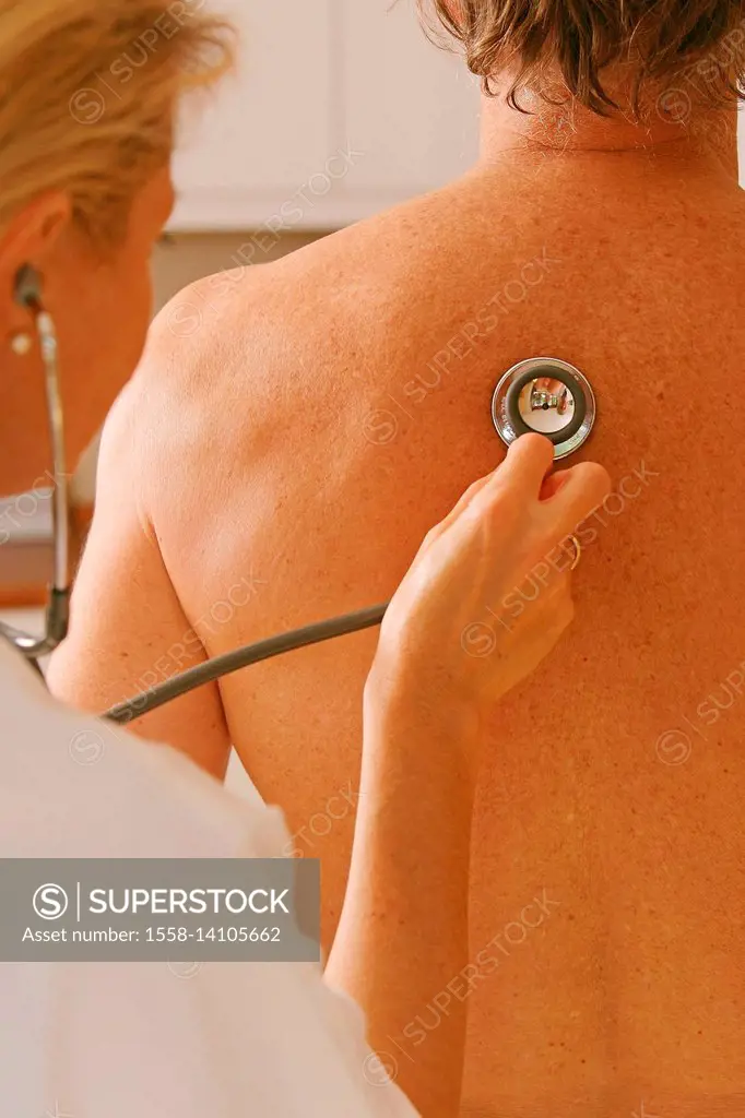 patient at stethoscope listens to doctor