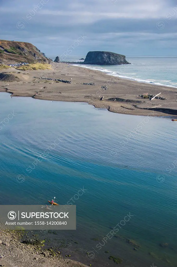 Kayakers at the Russian river flowing in the Pacific, Northern California, USA
