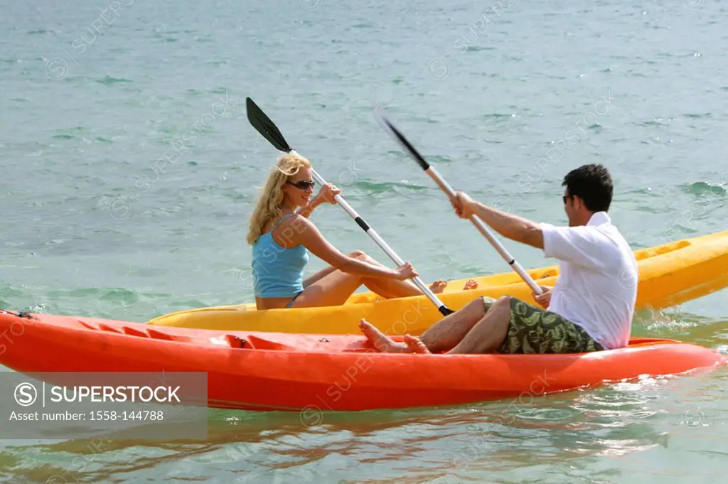 Man, woman, sea_kayaks, paddles,