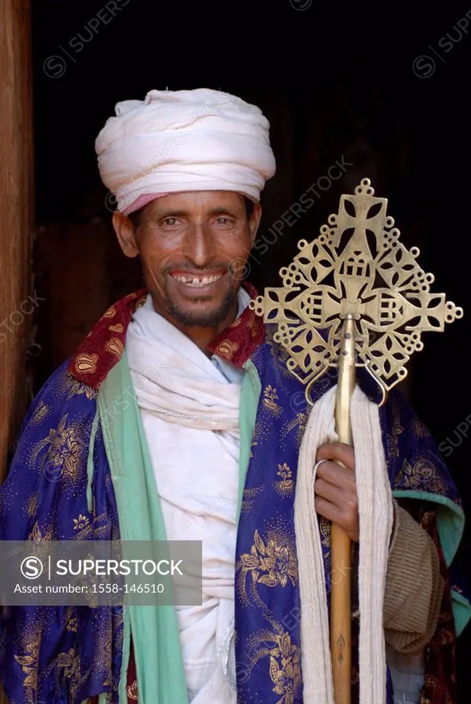 Ethiopia, Lalibela, church, priests, detail, laughs Africa, East_Africa, people, native man headgear, turban, cross, silver_cross, holding, cheerfully...
