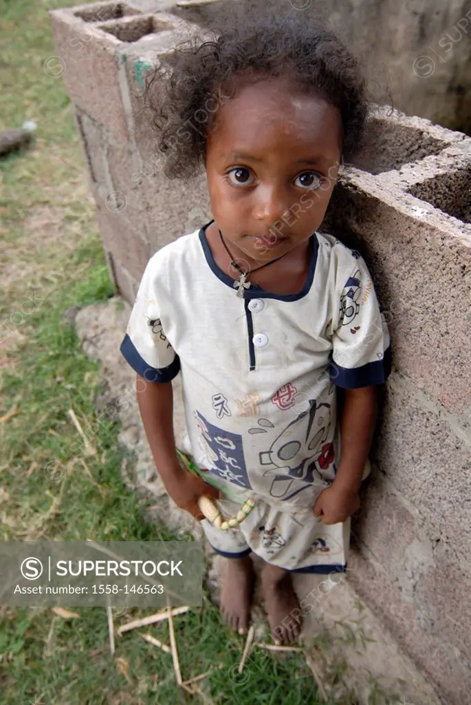 Ethiopia, Tana_lake, brick_wall, girl, barefoot, Africa, East_Africa, people, natives, people, colored, child, toy, stands holds, childhood, intimidat...