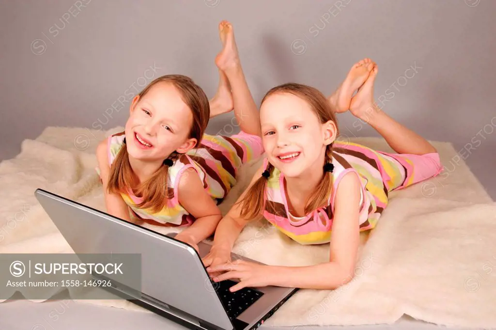 girl, twins, bed, lying, Notebook, data input, cheerfully, series, people, children, 6_10 years, siblings, sisters, twin_sisters, schoolgirl, matching...