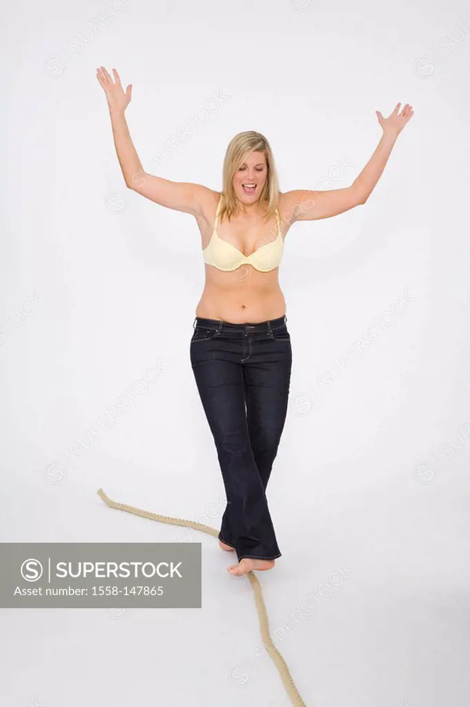woman, young, bra cozy, barefoot, rope, balances, series, people, 30_40 years, overweight, stout, pants, jeans, blond, long_haired, full_length, fun, ...