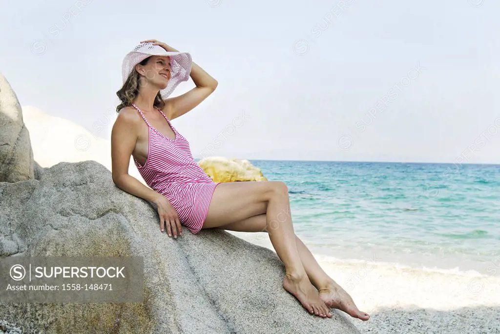 woman, young, summer_dress, hat, beach, rocks, sea view, sitting,