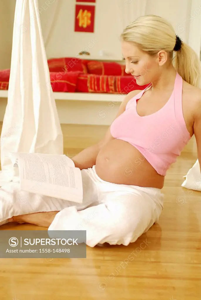 woman, young, pregnant, floor, sitting, reads,