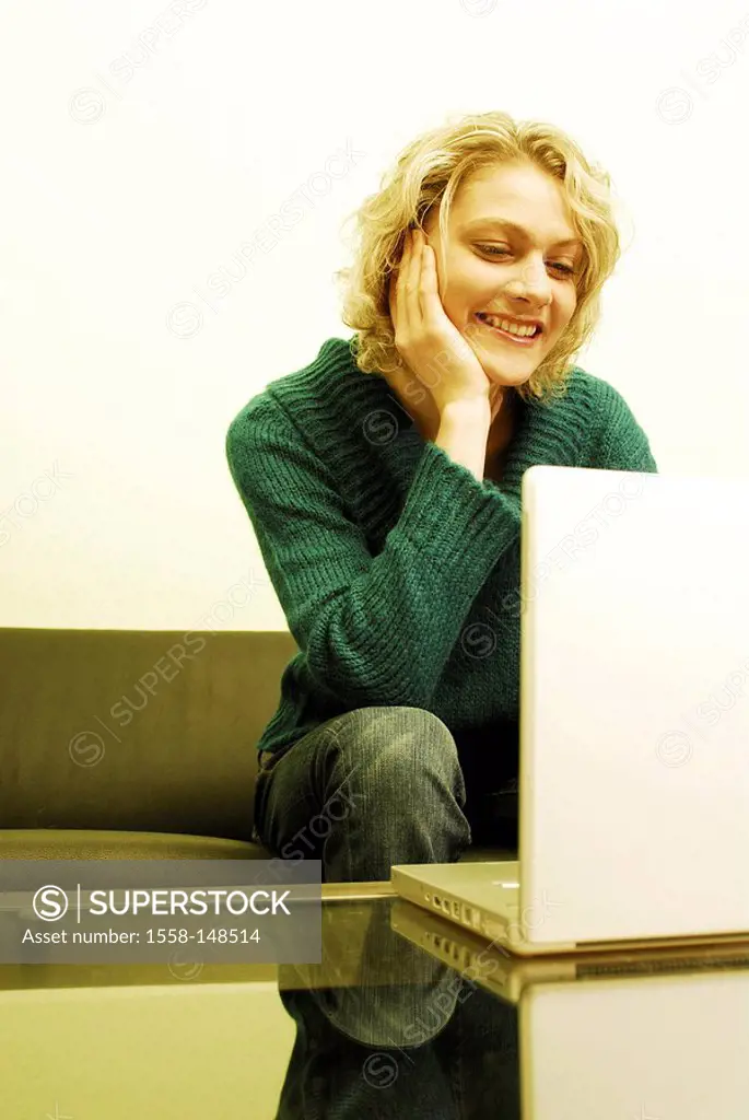 woman, young, blond, sofa, sitting, table, laptop,