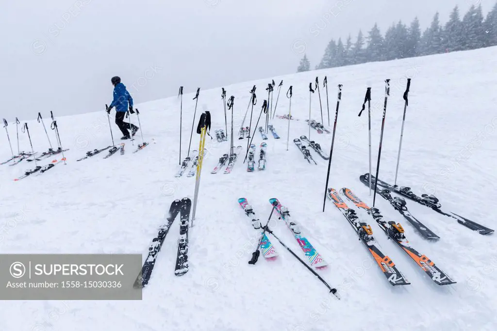 Austria, Montafon, Garfrescha, in front of a mountain restaurant, put down ski.