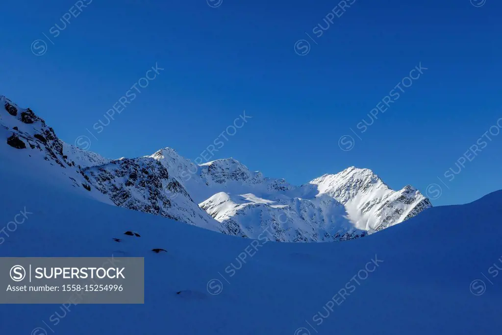 Bright mountains over cold shadows, view of Kraspesspitz and Schöllekogl, Tyrol