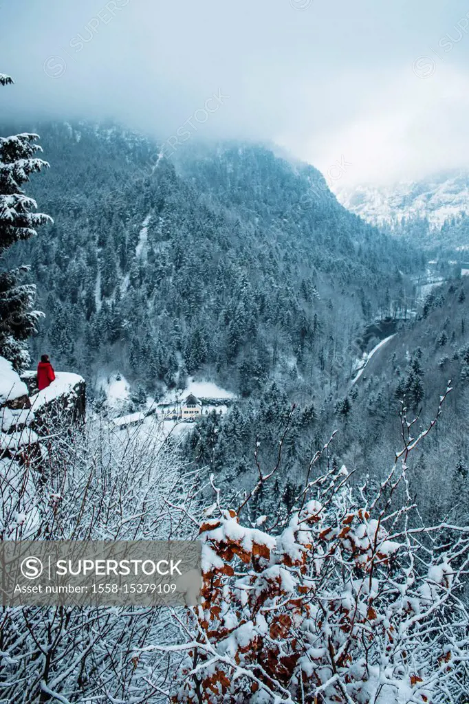 Germany, Bavaria, Berchtesgadener Land (district), person in red jacket at the ruins of Karlstein Castle