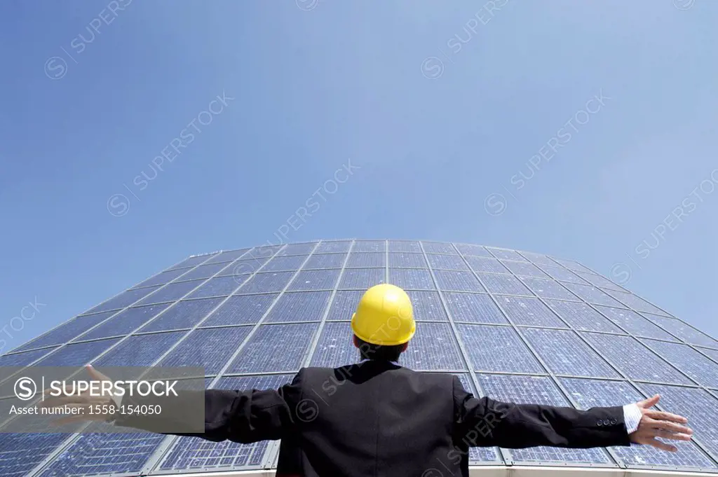 Architect, hard hat, solar cells, standing, gesture, portrait, back view, outside,