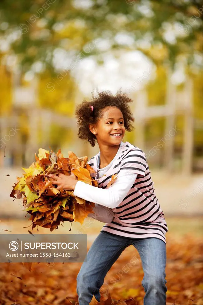 Girl, playing, black, fall foliage, toss up, ,