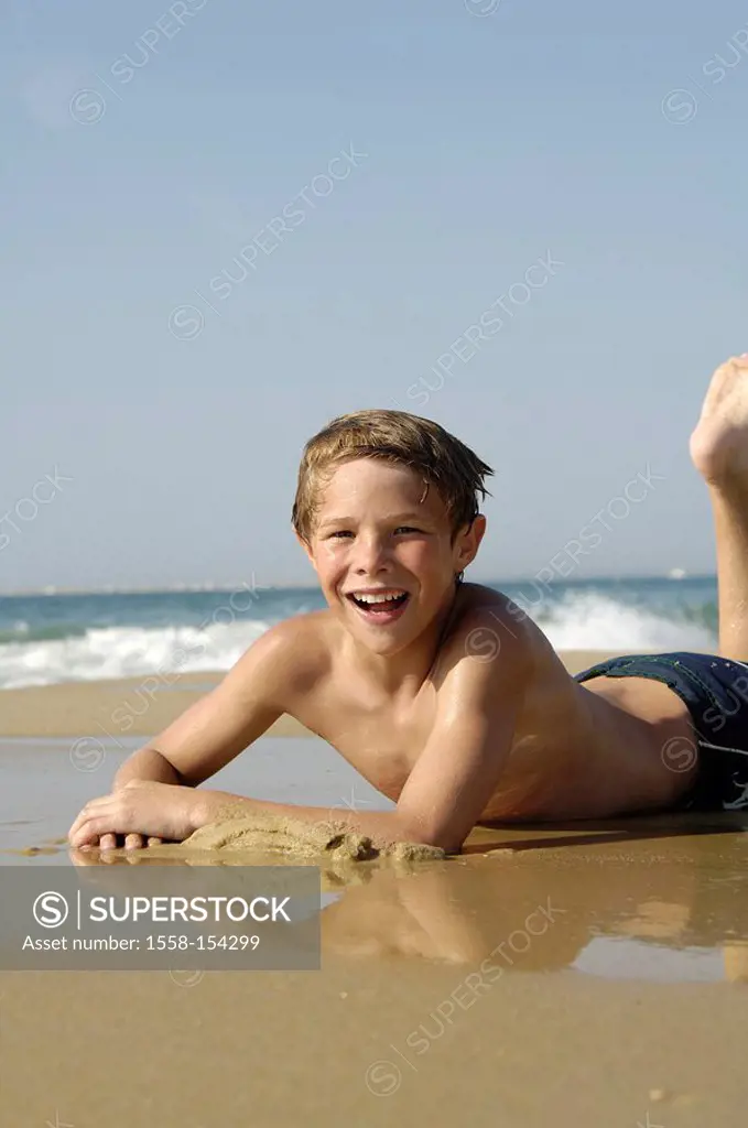 Boy, beach, sea, lying, joyful, light_hearted,
