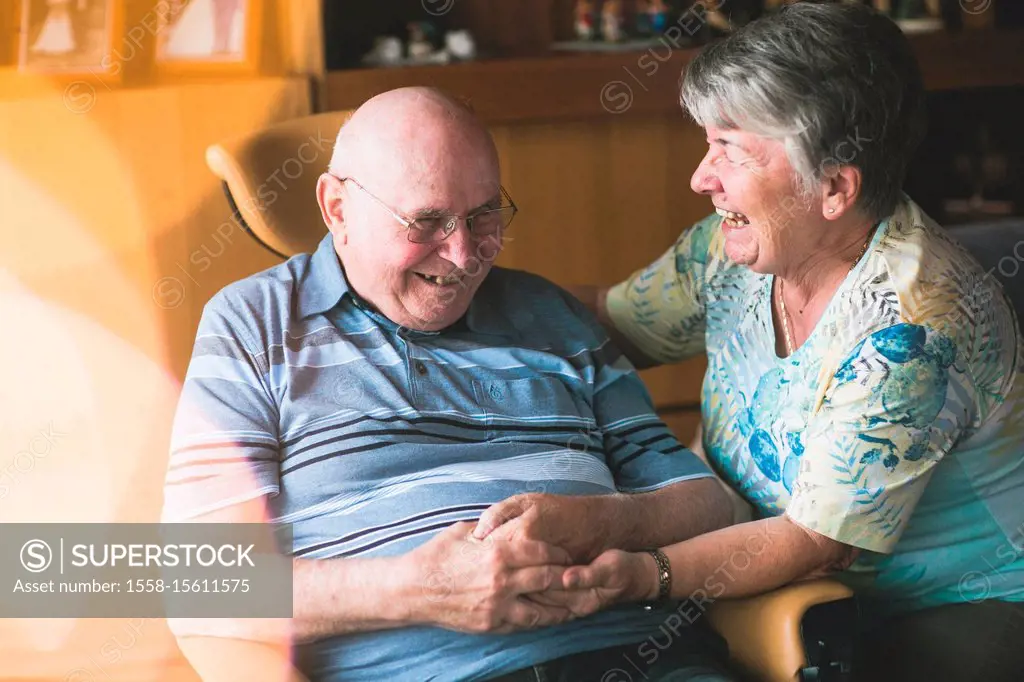 Laughing older couple in domestic environment