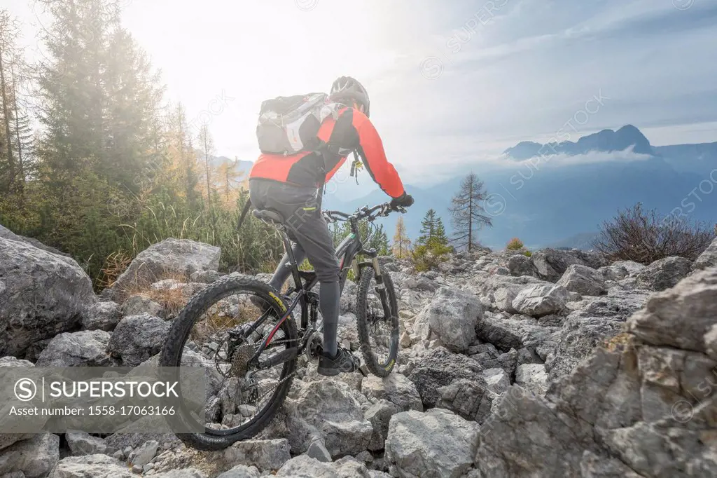 Mountainbiker extreme in Dolomites, Agordino, Belluno, Veneto, Italy