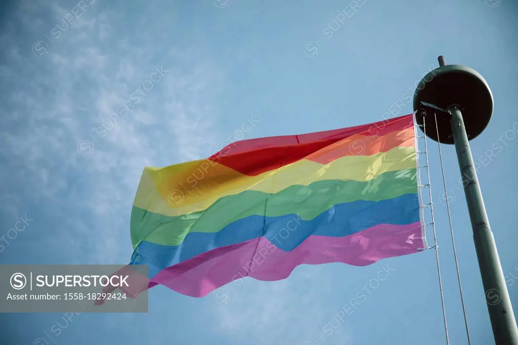 Flagpole, rainbow flag, sky