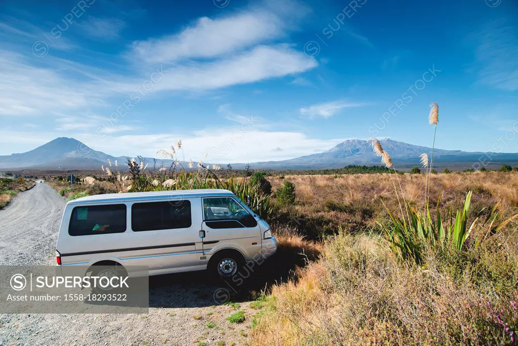 Campervan with the volcanoes of Tongariro National Park in the background, New Zealand