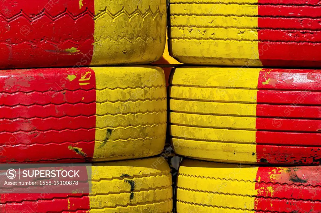 Construction site barrier with yellow and red car tires, Gislaved, Sweden