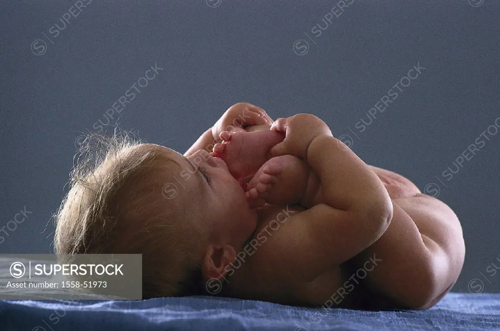 Baby, bare, supine position, foot, toes, mouth, indoors, child, childhood, touches, lies, movable, movement, development phase, development, whole bod...