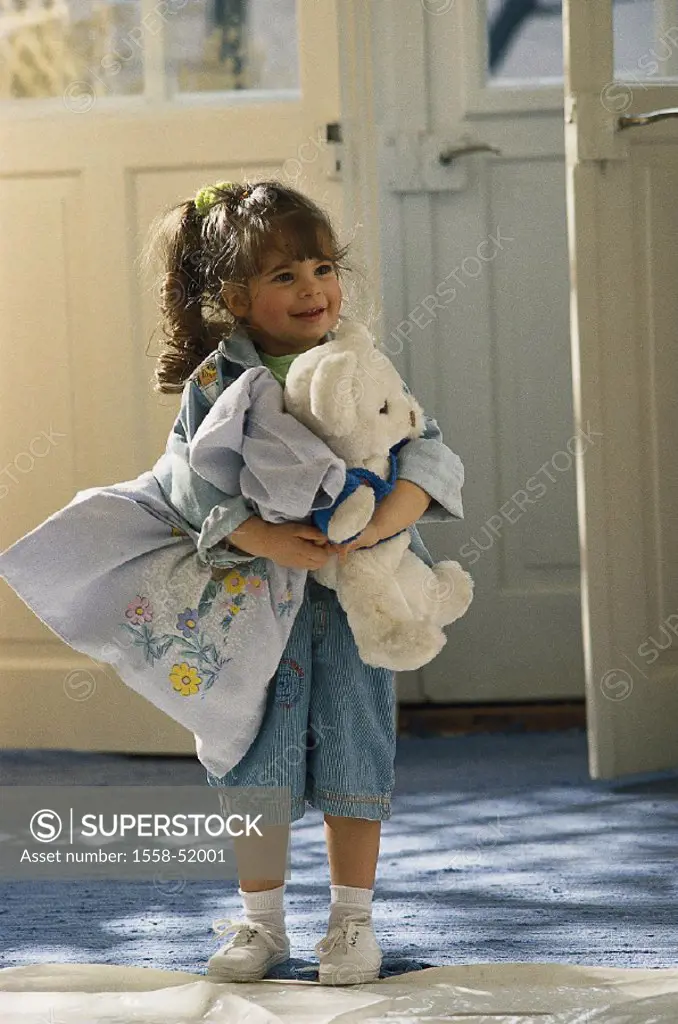 Child, girls, teddy, cuddly pillow, indoors, stands, at home, toddler, waits, smiles, cheerfully, childhood, ponytail, dark-haired, jeans clothing, te...