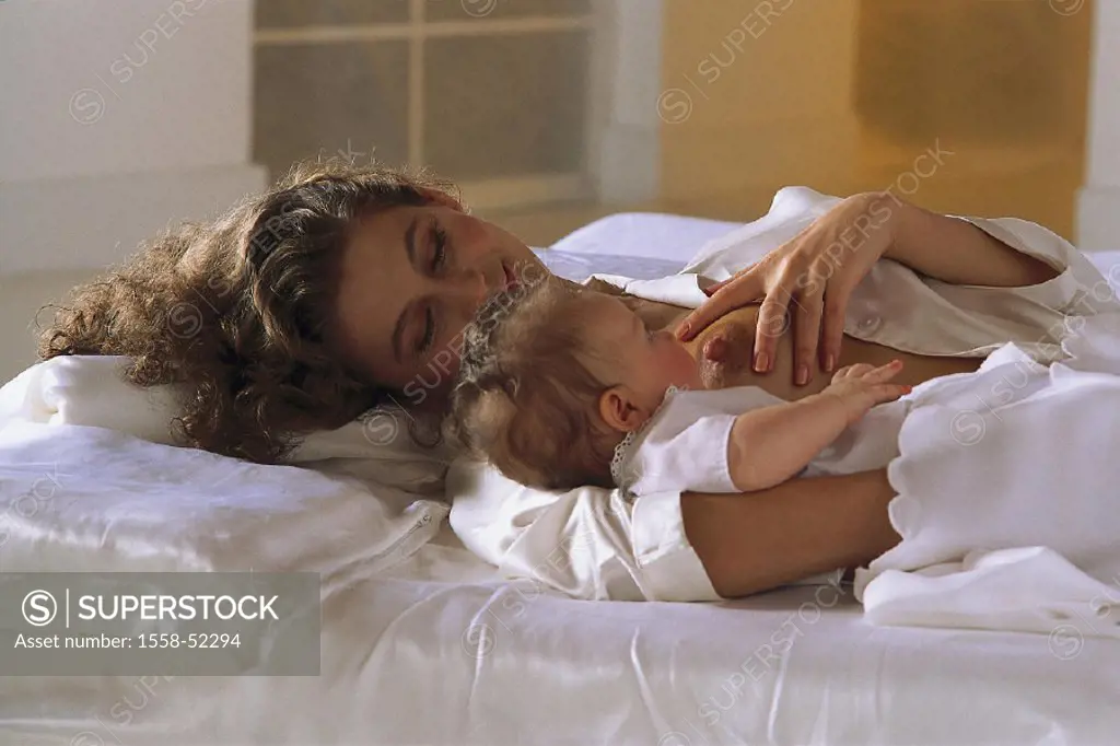 Bed, mother, baby, nurses, indoors, at home, woman, young, smiles, happily, breast, bosoms nipple, child, toddler, infant, lies, love, affection, tend...