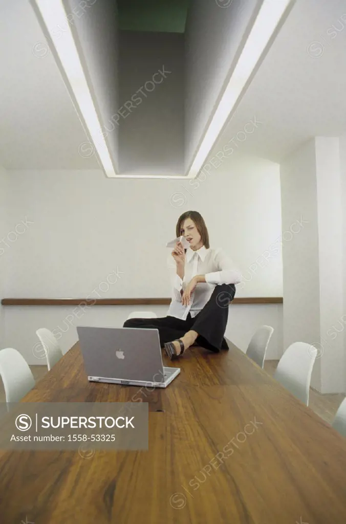 Conference area, table, manager, sit, gesture, paper planes, laptop, job, businesswoman, throws, loosely, uninhibited, undisturbed, unobserved, alone,...
