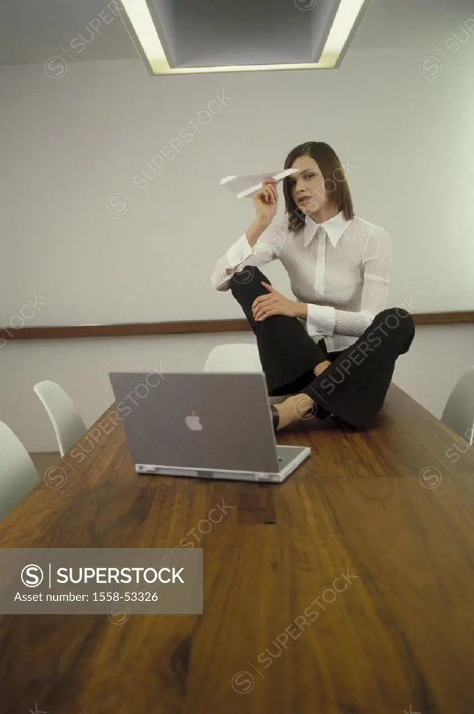 Conference area, table, manager, sit, gesture, paper planes, laptop, job, businesswoman, throws, loosely, uninhibited, undisturbed, unobserved, alone,...
