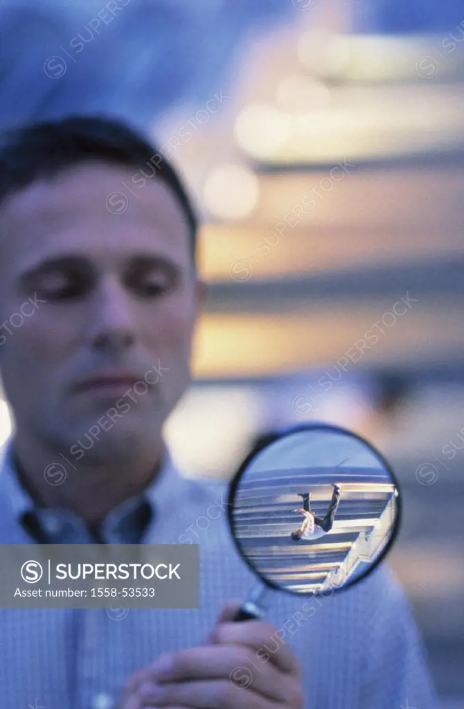 Man, magnifying glass, observation