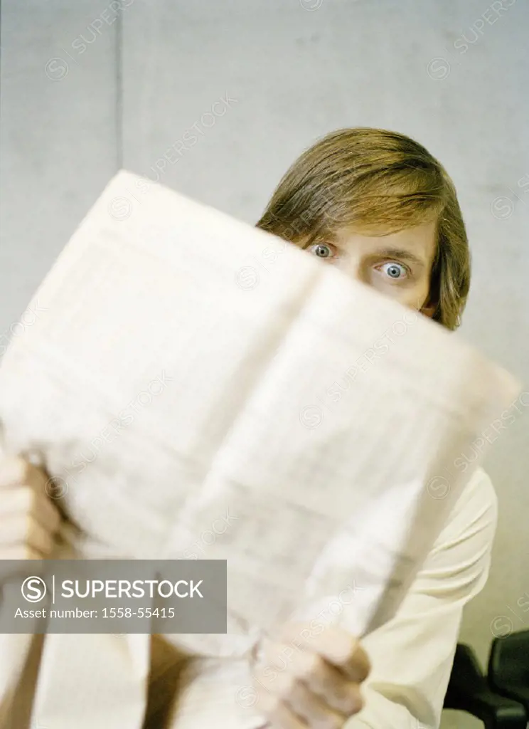 Man, stock exchange newspaper, gaze