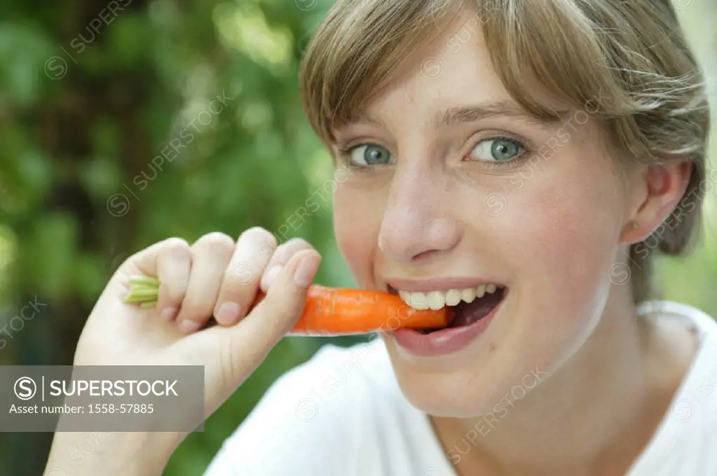 Woman, smiles, carrot, eats