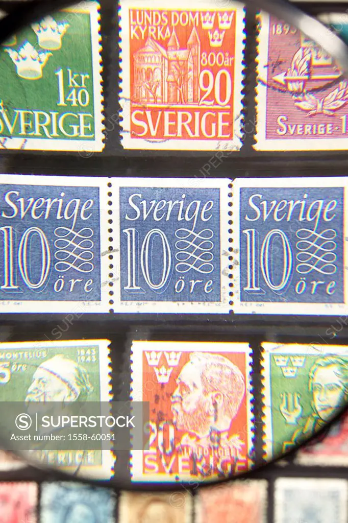 Stamp collection, magnifying glass, close-up   Postage stamps collect philately hobby, collection, collecting stamps, stamps collectibles, collective ...