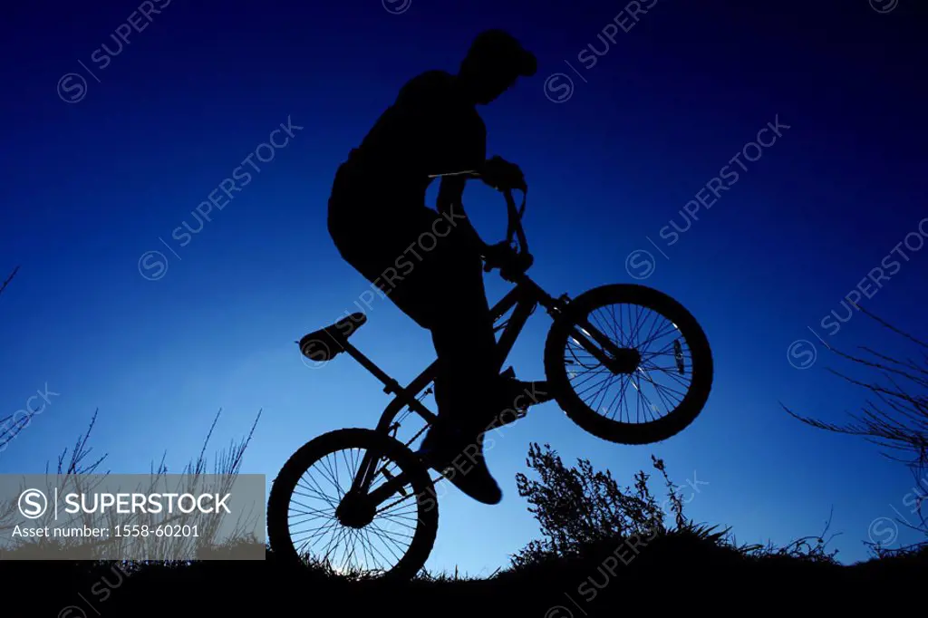 Silhouette, BMX-driver, back wheel,  drives, on the side, back light  cycling, trend sport, Funsport, man, young, teenager, 20-30 years, BMX-Fahren, B...