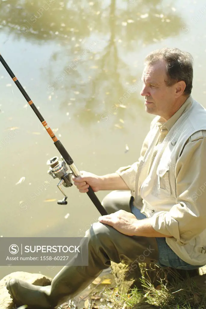 Shores, anglers, on the side, sitting, stone   Series, man, 40-50 years, 50-60 years, clothing, watt boots, waterproof, leisure time, hobby, sport, fi...
