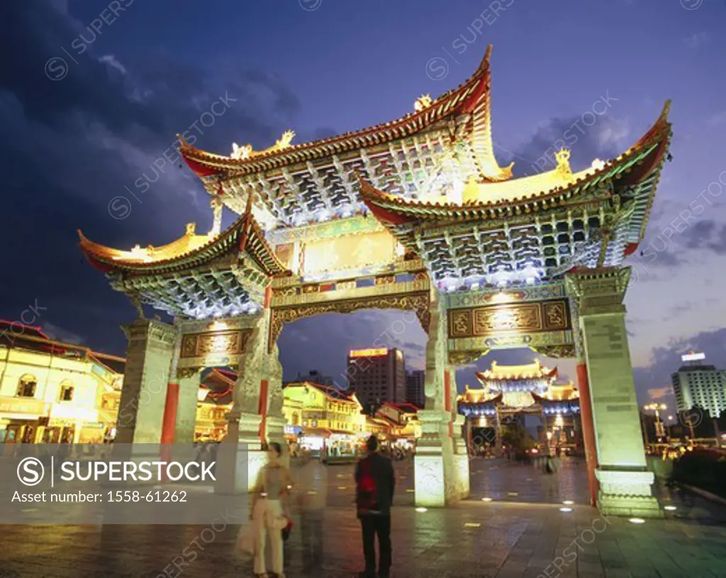China, province Yunnan, Kunming,  Down Town, Jinbi street, gate,  Illumination, evening, passer-bys Asia, Eastern Asia, city, province capital, distri...